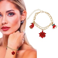 Bracelet avec bonnet, cloche et fleur de Noël dorés - 1 unité